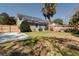 Spacious backyard featuring a wooden fence, grass yard, a utility shed and solar panels on the roof at 2612 Morning Dove Ln, Charleston, SC 29414
