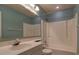 Bathroom featuring a sink, mirror, tub and shower, and a toilet with white cabinets at 2612 Morning Dove Ln, Charleston, SC 29414