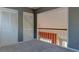 Spacious bedroom featuring neutral carpet, two closets and a railing overlooking the story below at 2612 Morning Dove Ln, Charleston, SC 29414