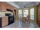 Eat-in kitchen with tile floors, light wood cabinets, bay windows and appliances at 2612 Morning Dove Ln, Charleston, SC 29414