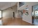 Open-concept living room with hardwood floors, high ceilings, and lots of natural light at 2612 Morning Dove Ln, Charleston, SC 29414