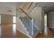 Living room featuring hardwood floors, natural light and stairs with white railings and carpet at 2612 Morning Dove Ln, Charleston, SC 29414