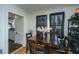 Inviting dining space with wood floors, a dark table, and natural light at 2671 Houston St, North Charleston, SC 29405