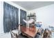 Charming dining area with a wooden table and a view to the outside at 2671 Houston St, North Charleston, SC 29405