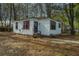 Charming single-story home with white siding, black trim, and inviting front entrance at 2671 Houston St, North Charleston, SC 29405