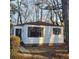 Charming single-story home featuring a well-maintained yard, black shutters and a welcoming front door at 2671 Houston St, North Charleston, SC 29405