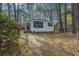 Charming house with a quaint front entrance and a pathway leading to the front door at 2671 Houston St, North Charleston, SC 29405
