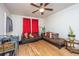 Comfortable living room with hardwood floors, bright windows, and cozy furnishings at 2671 Houston St, North Charleston, SC 29405