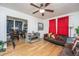 Open-concept living space with hardwood floors, connecting to a dining area at 2671 Houston St, North Charleston, SC 29405