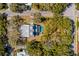 Aerial view of a backyard featuring a pool and spa with an intricate overhead tree canopy at 2802 Ion Ave, Sullivans Island, SC 29482