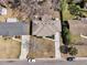 Aerial view showcases the home's roof, driveway, and landscaping, along with surrounding neighborhood and mature trees at 303 Gippy Dr, Summerville, SC 29486