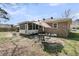 Brick house backyard with outdoor seating and a screened-in porch at 303 Gippy Dr, Summerville, SC 29486