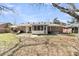 Large backyard with covered patio, outdoor furniture, and mature tree at 303 Gippy Dr, Summerville, SC 29486