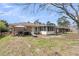 Spacious backyard with a covered patio and ample green space at 303 Gippy Dr, Summerville, SC 29486