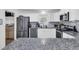 Bright kitchen featuring stainless steel appliances, white cabinets, granite countertops, and a breakfast bar at 303 Gippy Dr, Summerville, SC 29486