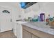 Bright laundry room with granite countertops and modern appliances at 303 Gippy Dr, Summerville, SC 29486