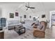 Comfortable living room featuring bright white walls, light wood flooring, and a ceiling fan at 303 Gippy Dr, Summerville, SC 29486