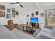 Cozy living room featuring a ceiling fan, eclectic decor, and comfortable seating area with natural light at 303 Gippy Dr, Summerville, SC 29486