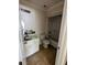 Bathroom needing repair with damaged sink, and mirror, and a shower; ready for a complete renovation at 305 Sandridge Rd, Dorchester, SC 29437