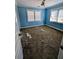 Bedroom needing repair with damaged ceiling fan and windows; ready for a complete renovation at 305 Sandridge Rd, Dorchester, SC 29437