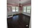 Dining room featuring hardwood floors, neutral walls with white trim, and a chandelier at 305 Sandridge Rd, Dorchester, SC 29437