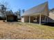 Exterior shot of a garage with an open carport area connected to the main building at 305 Sandridge Rd, Dorchester, SC 29437