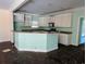 Outdated kitchen needing remodeling, featuring dated cabinets, countertops, and flooring, presenting a renovation opportunity at 305 Sandridge Rd, Dorchester, SC 29437