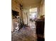 Hallway featuring hardwood floors and an ironing board at 306 Perry Rd, Walterboro, SC 29488