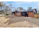 Rear exterior view of a brick home with a covered patio at 313 Runnymede Ln, Summerville, SC 29485