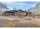Exterior of a home showcasing the covered patio and backyard at 313 Runnymede Ln, Summerville, SC 29485