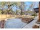 Spacious backyard with a brick planter and privacy fence at 313 Runnymede Ln, Summerville, SC 29485