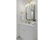 Bright bathroom vanity featuring a gold faucet and mirror at 313 Runnymede Ln, Summerville, SC 29485