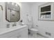 Bright bathroom with updated vanity, framed mirror, and tiled shower reflected in mirror at 313 Runnymede Ln, Summerville, SC 29485