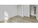 Bedroom with neutral walls, wood-look flooring, and a closet at 313 Runnymede Ln, Summerville, SC 29485