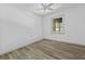 A bright bedroom with neutral walls and wood-look flooring, showcasing a window at 313 Runnymede Ln, Summerville, SC 29485