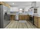 Open kitchen boasts stainless appliances and an undermount sink with a view at 313 Runnymede Ln, Summerville, SC 29485