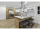 Updated eat-in kitchen boasts a stylish vent hood and stainless appliances at 313 Runnymede Ln, Summerville, SC 29485