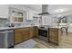 Updated eat-in kitchen features stainless appliances, modern lighting, and a view at 313 Runnymede Ln, Summerville, SC 29485