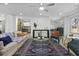 Bright living room features a decorative rug, comfortable seating, and seamless flow into kitchen at 313 Runnymede Ln, Summerville, SC 29485