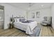 Spacious main bedroom offers a ceiling fan, neutral colors, and a comfortable chair at 313 Runnymede Ln, Summerville, SC 29485
