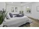 Bright main bedroom features a ceiling fan, large windows, and neutral decor at 313 Runnymede Ln, Summerville, SC 29485