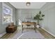 Cozy home office with natural light, stylish decor, and a serene atmosphere at 313 Runnymede Ln, Summerville, SC 29485