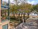 Scenic view from a multi-story balcony overlooking Waterfront Park with trees, park benches, and harbor views at 32 Prioleau St # N, Charleston, SC 29401