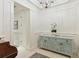 Hallway featuring decorative cabinet with artistic floral design and travertine tile flooring at 32 Prioleau St # N, Charleston, SC 29401