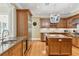 Spacious kitchen with stainless steel appliances, custom cabinets, and granite countertops at 32 Prioleau St # N, Charleston, SC 29401