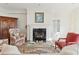 Bright living room featuring a fireplace, a glass-top coffee table, and comfortable seating at 32 Prioleau St # N, Charleston, SC 29401