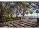 Picturesque waterfront park with mature trees, pedestrian walkway, stairs, and a scenic harbor view at 32 Prioleau St # N, Charleston, SC 29401