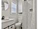 Contemporary bathroom with a modern vanity, tiled shower, and elegant fixtures at 33 Athens Ct, Charleston, SC 29403
