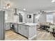Open-concept kitchen with stainless appliances, sleek white countertops, and seamless access to living area at 33 Athens Ct, Charleston, SC 29403