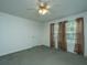 This light bedroom features a ceiling fan, space for a desk, and a view to the outdoors at 3596 Walter Drive Dr, Johns Island, SC 29455